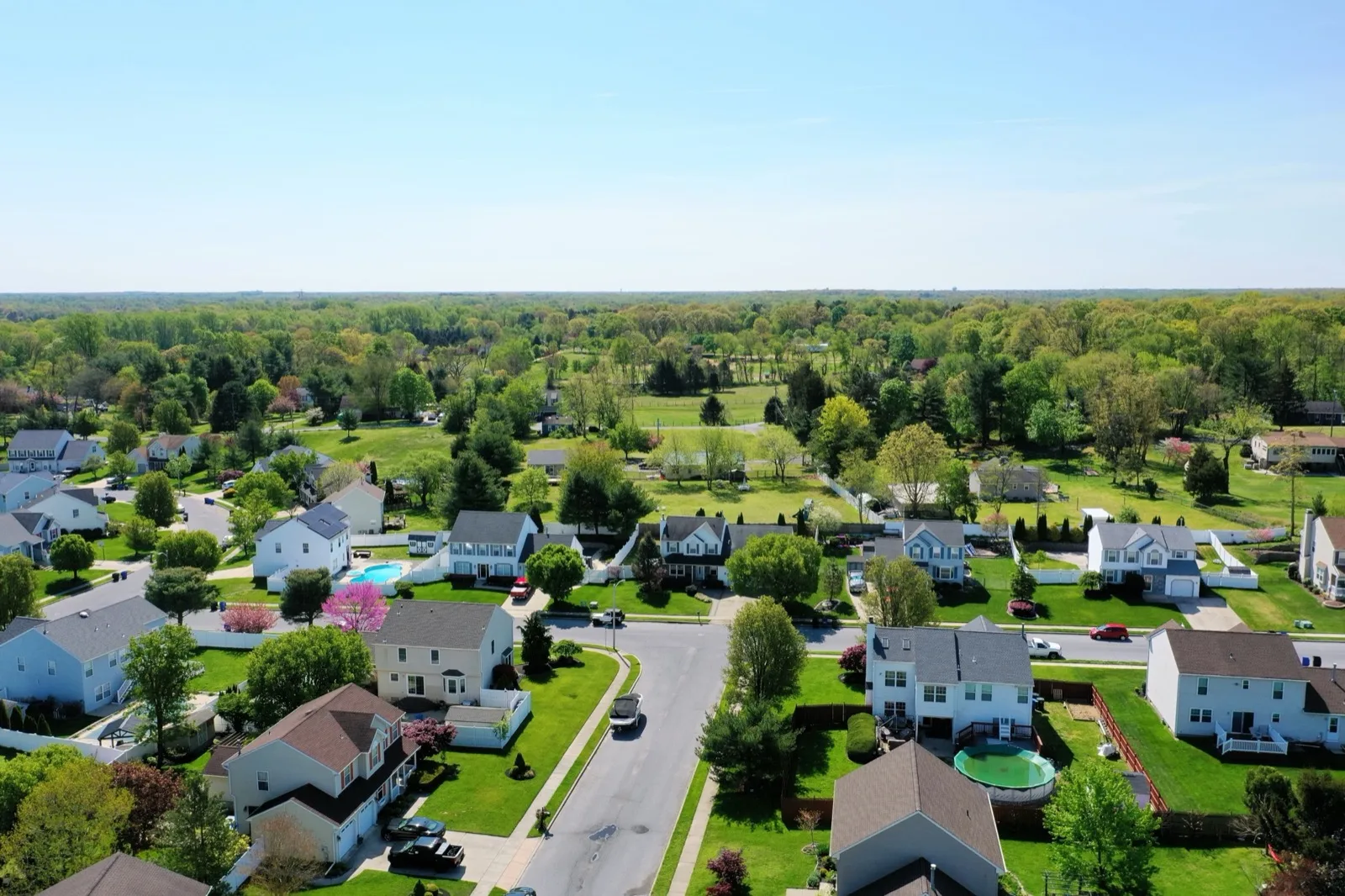 Aerial view of an established Gloucester County, New Jersey neighborhood of single family homes in spring
