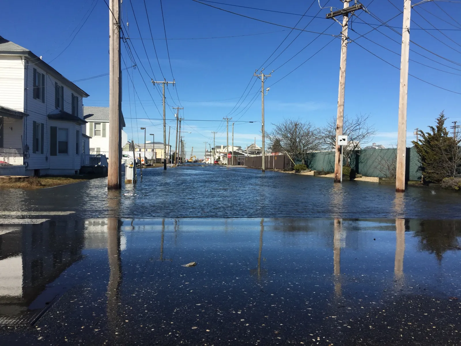 Tidal water standing across a residential street in Ocean City, New Jersey